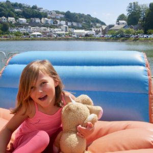 A bouncy castle with a view of Looe.