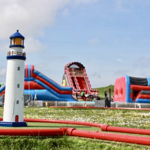 Arty photo of our crazy golf course and bouncy castles in Newquay in 2023.